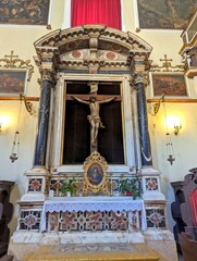 The altar with the crucifix in the Franciscan Church of the Little Brothers in the Old Town of Dubrovnic, Croatia