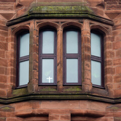 A small cross in an apartment window