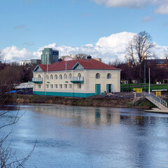 A view of a boathouse from across the river