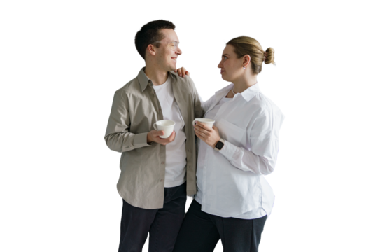 Young couple drinking coffee together hugging, cut out