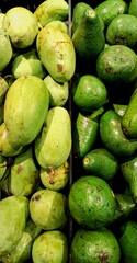 mangoes and avocados in the market