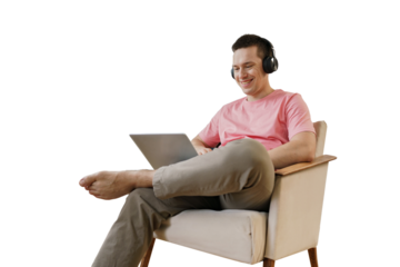 A male freelance programmer uses a laptop cut out