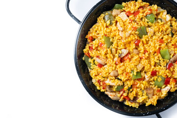 Yellow rice with chicken and vegetables isolated on white background. Top view. Copy space