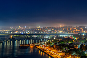Fototapeta na wymiar View of Istanbul from Pierre Loti Hill (Hill). Beautiful day cityscape with Golden Horn Bay, buildings and sky at sunrise time . Travel background for wallpaper or guidebook