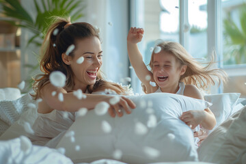 Mother and Daughter Having a Pillow Fight in a Bright Bedroom