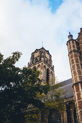 Rotterdam, South Holland, Netherlands - October 29, 2023, View of the Old Church Under a Cloudy Blue Sky