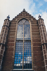 Rotterdam, South Holland, Netherlands - October 29, 2023, View of the Old Church Under a Cloudy Blue Sky
