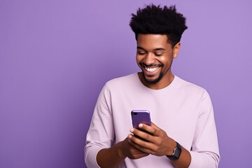Happy African American man with phone on Lavender studio background