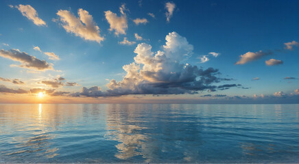 sunset over the sea water surface with white clouds, blue sky, ocean landscape