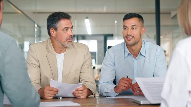 Happy busy professional business people company executives, bankers or financial advisors consulting clients at group meeting working together having conversation in office sitting at table.