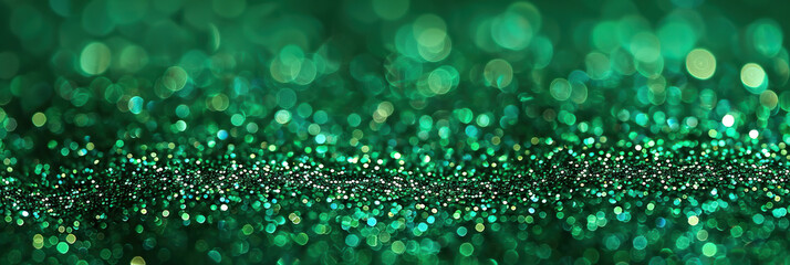 Abstract shiny green glitter background. Emerald green glitter wide horizontal background
