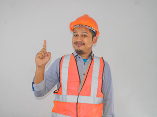 Asian workers wearing safety vest and helmets are seen looking for ideas in completing work against white background
