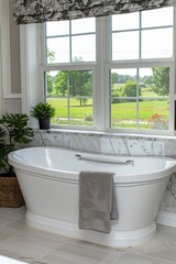 Elegant bathroom with serene ambiance featuring a luxurious white standalone bathtub