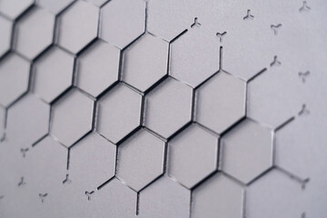 The background of the gray embossed wall texture has a geometric relief pattern