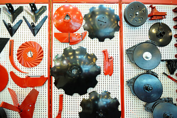 Parts of harrow, seeding mashines and cultivators presentesd on stand. Kyiev, Ukraine