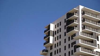 side facade of modern residential building against the sky