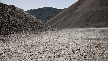hills of gravel piled against the sky