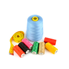 Set of threads for sewing and Measuring tape isolated on a white.