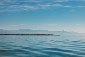 Amazing view of Skadar Lake and beautiful mountains on a sunny morning. Travel destination in...