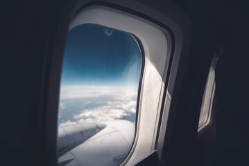 Airplane window with a beautiful sky - 796525457