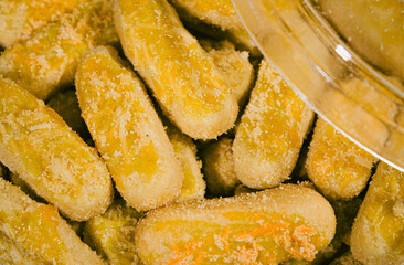 Long cheesecakes are packaged in round boxes and photographed close up