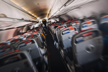 aerophobias concept. plane shakes during turbulence flying air hole. Blur image commercial plane...