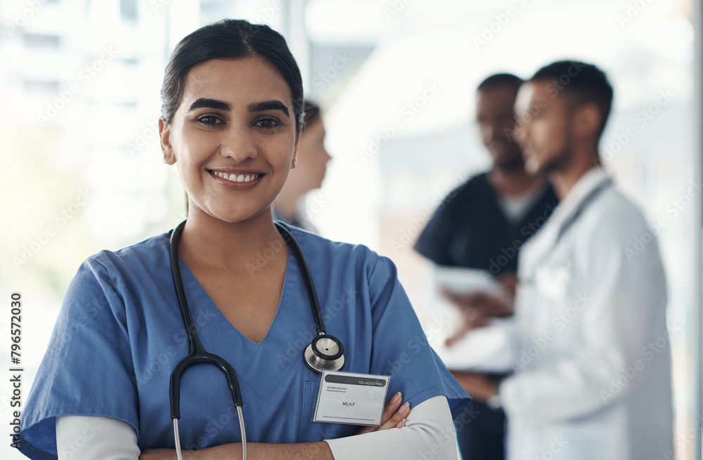 Canvas Prints Portrait, confident nurse and happy woman in hospital for healthcare career, wellness and proud doctor. Face, smile and medical professional with arms crossed, surgeon or expert employee coworking