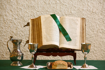 Protestant  church. Bible, bread and wine in a temple.