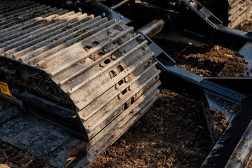 Construction excavator working close up on construction job site