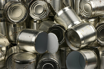Open old metal tin cans background.