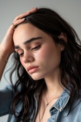 Naklejka premium Young brunette woman portrait worried photo.