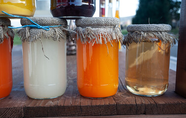 Honey glass jars on table close up