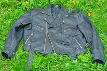  one leather stylish black dirty classic biker unbuttoned with iron zippers heavy old jacket lies...
