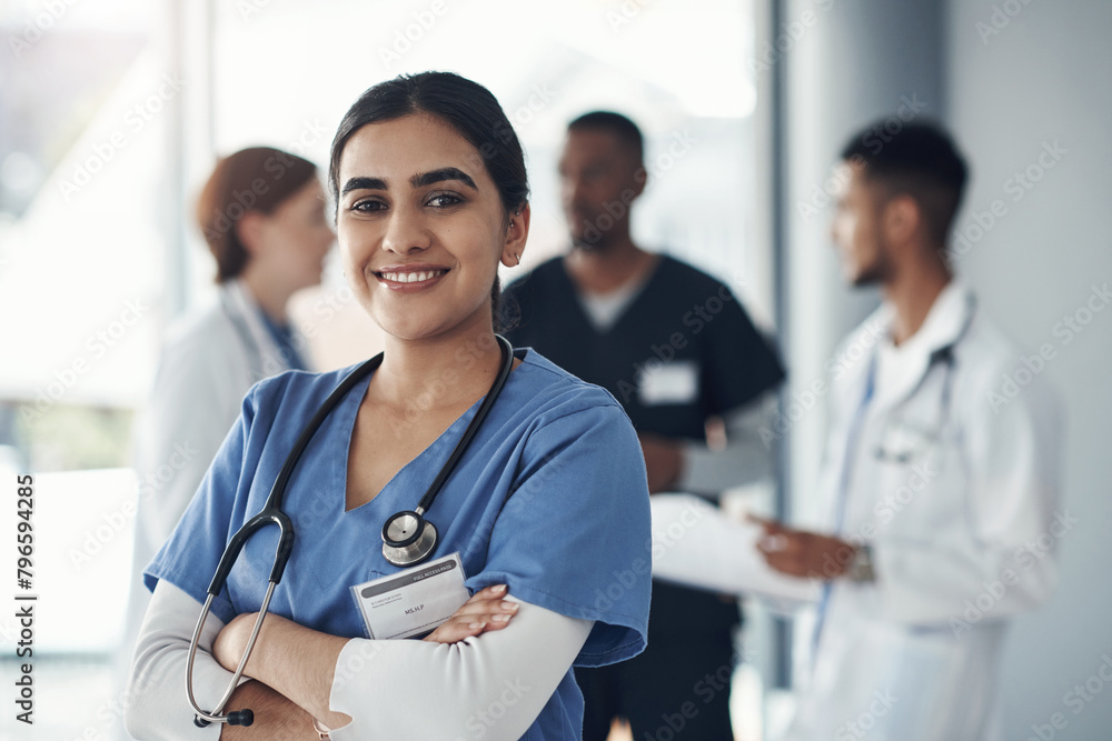 Canvas Prints Portrait, nurse and happy woman with arms crossed in hospital for healthcare career, wellness or proud doctor. Face, smile and confident medical professional surgeon, expert or coworking employee