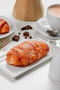 xuixo typical of spain, and cup of coffee