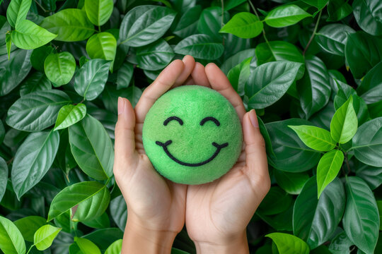 top view hands holding green happy smiley face emoji good feedback rating and positive customer review