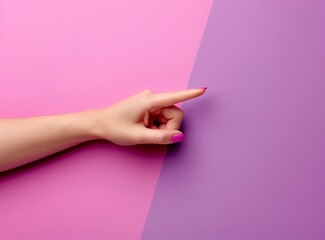 woman hand pointing the finger at something against pink and lilac background