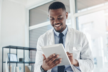 Doctor, black man and happy with tablet online results of electronic health records, improved...