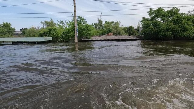 Flooding in Kherson town as a result of the explosion of a dam on the Dnipro river in city of Novaya Kakhovka. Consequences of the detonation of Kakhovka Hydroelectric Power Station. War in Ukraine