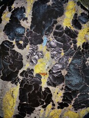 Peeling faux leather couch. A close-up of a damaged Gray faux leather.torn car cushion.Showing to the Gray leather car seat damaged corner. Problem Car seat cracking.