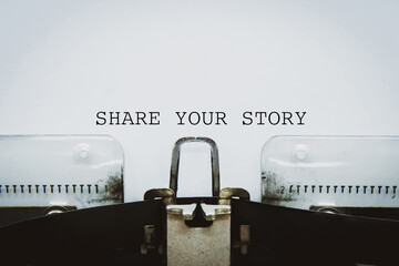 “Share your story” text typed on a vintage typewriter