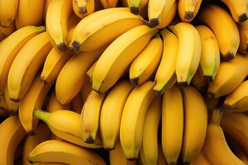Several ripe bananas stacked on top of each other.