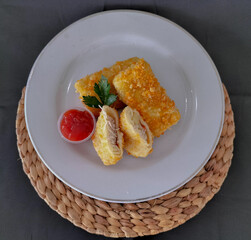 Risoles mayo or mayonnaise rissole is a pastry filled with meat, usually ground beef, mayonnaise and wrapped vegetables. Selective focus.
