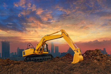 Crawler Excavators are digging the soil in the construction site on the  sunset  sky background