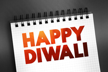 Happy Diwali text on notepad, concept background