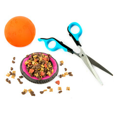 Pet accessories concept. Dry food, Scissors and toy for pet on isolated white. Collage.