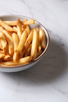 Bowl of hot chips on marble table