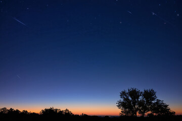 Night blue sky with stars. Evening sky on the horizon.