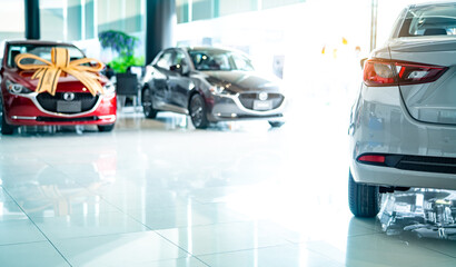 New car parked in luxury showroom. Car dealership. Modern luxury car showroom. Automotive industry. New car stock in showroom. Electric and hybrid vehicle. Automobile leasing and insurance background.