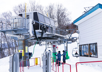 Structure steel way up  lift or ropeway to go skiing snow covered with sky is overcast. People...